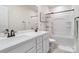 White bathroom features dual sink vanity with a modern white soaking tub at 7318 Rupell Dr, Charlotte, NC 28273