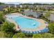 Large community pool with plenty of lounge chairs and umbrellas, perfect for relaxation and recreation at 7318 Rupell Dr, Charlotte, NC 28273