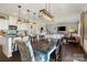 Open concept living space featuring dining area, kitchen with white cabinets, and a comfortable living room at 7318 Rupell Dr, Charlotte, NC 28273