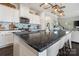 Open kitchen design with a large island, modern appliances, and backsplash at 7318 Rupell Dr, Charlotte, NC 28273