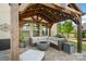 Inviting outdoor patio featuring a cozy fire pit and comfortable seating under a charming wooden pergola at 7318 Rupell Dr, Charlotte, NC 28273