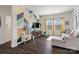 Bright playroom featuring a colorful accent wall, play kitchen, and comfortable seating area with natural light at 7318 Rupell Dr, Charlotte, NC 28273