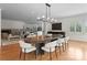 Elegant dining room featuring stylish lighting, hardwood floors, and an open layout, great for entertaining at 8300 Fairview Rd, Charlotte, NC 28226