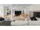 Bright living room featuring hardwood floors, a decorative fireplace, and an open floor plan at 8300 Fairview Rd, Charlotte, NC 28226