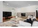 Inviting living room with tile fireplace, hardwood floors, and a modern television for entertainment at 8300 Fairview Rd, Charlotte, NC 28226
