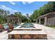 The home offers a pristine pool and hot tub area with multiple entertaining zones and seating options at 8300 Fairview Rd, Charlotte, NC 28226