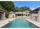 This spacious pool offers plenty of room to swim and relax with an outdoor bar and seating area at 8300 Fairview Rd, Charlotte, NC 28226