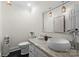 Powder room featuring a vessel sink, pendant lights, and a framed mirror at 8300 Fairview Rd, Charlotte, NC 28226