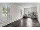 Bright sun room with large windows, tile floor and white trim, creating a peaceful and airy atmosphere at 8300 Fairview Rd, Charlotte, NC 28226