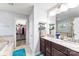 Bathroom with a double sink vanity, walk-in closet, soaking tub, walk-in shower, and neutral finishes at 865 Wingthorn Rose Dr, Gastonia, NC 28056