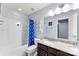 Bathroom featuring a shower-tub combination, dual sink vanity, neutral finishes, and bright lighting at 865 Wingthorn Rose Dr, Gastonia, NC 28056