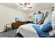 Cozy bedroom offering a blend of relaxation and fitness with a bed, dresser, and exercise equipment at 865 Wingthorn Rose Dr, Gastonia, NC 28056