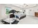 Bright bedroom featuring a tray ceiling, ceiling fan, carpeting, walk-in closet, and a treadmill for exercise at 865 Wingthorn Rose Dr, Gastonia, NC 28056