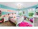 Charming bedroom with decorative accents, pink accents, and lots of natural light at 865 Wingthorn Rose Dr, Gastonia, NC 28056