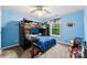 Bright bedroom with a unique bunk bed setup and a window offering lots of natural light at 865 Wingthorn Rose Dr, Gastonia, NC 28056