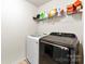 Laundry room with a side-by-side washer and dryer, plus a shelf for storage at 865 Wingthorn Rose Dr, Gastonia, NC 28056