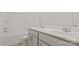 Bathroom with a dual sink vanity, framed mirror and a bathtub and shower combo at 9528 Maltese Dr, Gastonia, NC 28056
