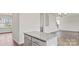 Kitchen island with granite countertop and stainless steel hardware, connects living spaces at 9528 Maltese Dr, Gastonia, NC 28056