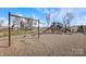 Community playground with swings and slides, a great place for to play and socialize at 9528 Maltese Dr, Gastonia, NC 28056