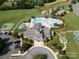 Aerial view showcasing the community pool, clubhouse, tennis courts, and amenities at 10217 Falling Leaf Dr, Concord, NC 28027