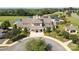 Aerial view of the community clubhouse with pool, tennis courts, and meticulously maintained grounds at 10217 Falling Leaf Dr, Concord, NC 28027