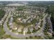 Aerial view of a residential area, showcasing the layout and tree coverage at 10217 Falling Leaf Dr, Concord, NC 28027