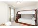 Spacious bedroom with carpet, neutral walls, a bunk bed and window with curtains at 10217 Falling Leaf Dr, Concord, NC 28027