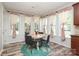 Charming breakfast nook featuring a chandelier, bright windows and stylish curtains at 10217 Falling Leaf Dr, Concord, NC 28027