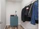 Storage closet with blue dresser and hanging rack at 10217 Falling Leaf Dr, Concord, NC 28027