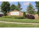Stone entrance sign for Winding Walk community, featuring manicured landscaping and a welcoming atmosphere at 10217 Falling Leaf Dr, Concord, NC 28027