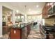 Open kitchen with stainless appliances, granite countertops, a center island, and a breakfast nook at 10217 Falling Leaf Dr, Concord, NC 28027