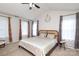 Spacious main bedroom with high ceilings, neutral carpet, and tasteful decor at 10217 Falling Leaf Dr, Concord, NC 28027