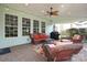 Relaxing outdoor patio with comfortable seating, ceiling fan, and barbecue grill at 10217 Falling Leaf Dr, Concord, NC 28027