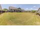 Expansive backyard with covered patios, well-manicured lawn, and secure fencing, perfect for outdoor activities and privacy at 1022 Curling Creek Dr, Indian Trail, NC 28079