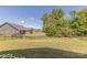 Spacious backyard featuring lush lawn and secure black fencing, perfect for outdoor activities and privacy at 1022 Curling Creek Dr, Indian Trail, NC 28079