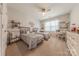 Bright and airy bedroom with two twin beds, a ceiling fan, and a comfortable workstation at 1022 Curling Creek Dr, Indian Trail, NC 28079