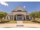 Elegant community clubhouse featuring a grand entrance, manicured landscaping, and welcoming architectural details at 1022 Curling Creek Dr, Indian Trail, NC 28079