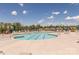Resort-style community pool with lounge chairs, umbrellas, and clear blue water, perfect for relaxation and summer fun at 1022 Curling Creek Dr, Indian Trail, NC 28079
