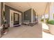 Inviting covered porch with a cozy bench seating area for enjoying the outdoors at 1022 Curling Creek Dr, Indian Trail, NC 28079