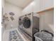 Well-organized laundry room with modern washer and dryer, and ample storage space at 1022 Curling Creek Dr, Indian Trail, NC 28079