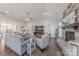 Inviting living room with stone fireplace, hardwood floors, and ample seating, perfect for relaxation and entertaining guests at 1022 Curling Creek Dr, Indian Trail, NC 28079