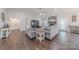 Bright living room with vaulted ceilings, a stone fireplace, and comfortable seating at 1022 Curling Creek Dr, Indian Trail, NC 28079