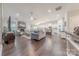 Open-concept living room and kitchen area, featuring hardwood floors and modern finishes at 1022 Curling Creek Dr, Indian Trail, NC 28079