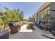 Relaxing patio with wicker furniture, perfect for outdoor living and entertaining with comfortable seating and modern decor at 1022 Curling Creek Dr, Indian Trail, NC 28079