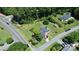 Aerial view of property featuring a well-maintained lawn and mature trees at 1105 S Point Rd, Belmont, NC 28012