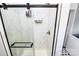 Contemporary bathroom featuring white marble tiles, a glass shower door, and modern fixtures at 1105 S Point Rd, Belmont, NC 28012