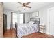 Bright bedroom with floral bedding and lots of natural light at 1105 S Point Rd, Belmont, NC 28012