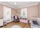 Charming bedroom with natural light, alphabet rug, and a cozy armchair at 1105 S Point Rd, Belmont, NC 28012
