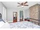Bedroom with a brick accent wall and hardwood floors at 1105 S Point Rd, Belmont, NC 28012