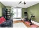 Cozy bedroom features wood floors, ample lighting, and Peloton at 1105 S Point Rd, Belmont, NC 28012